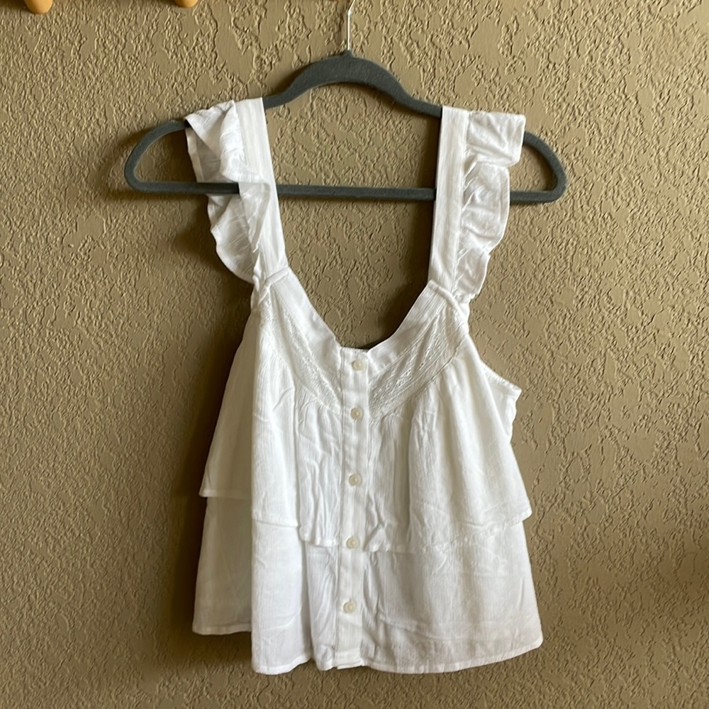 White ruffled tank